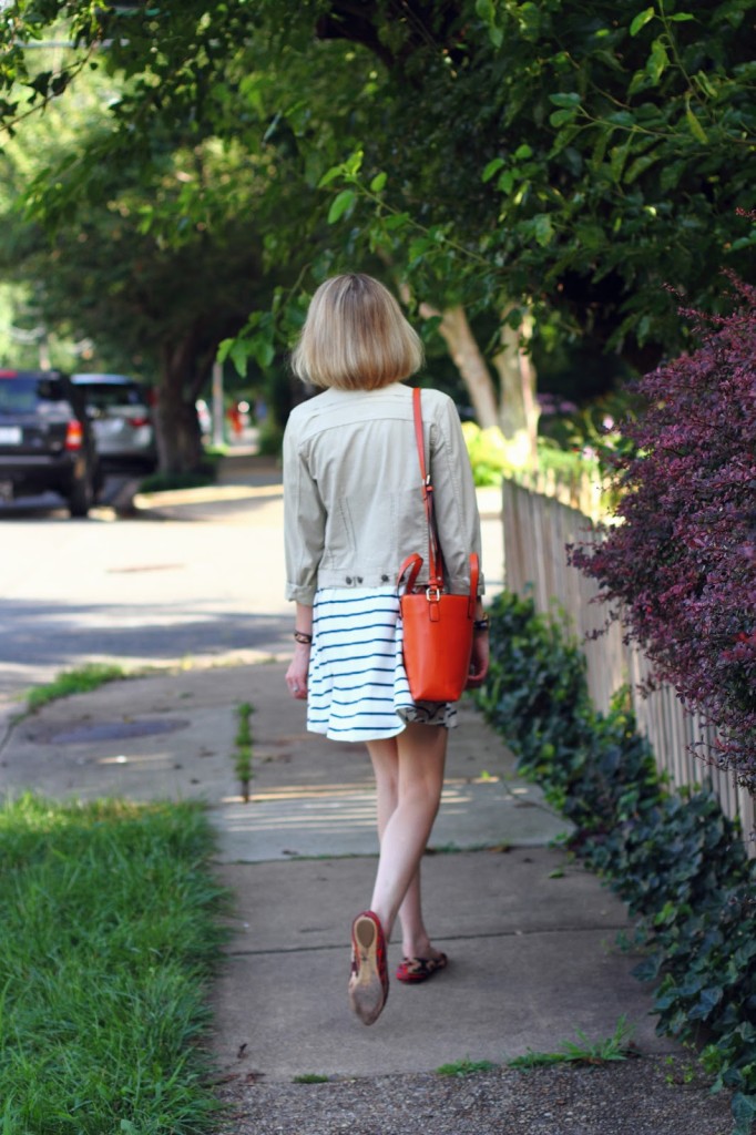orange tote and navy striped swing dress