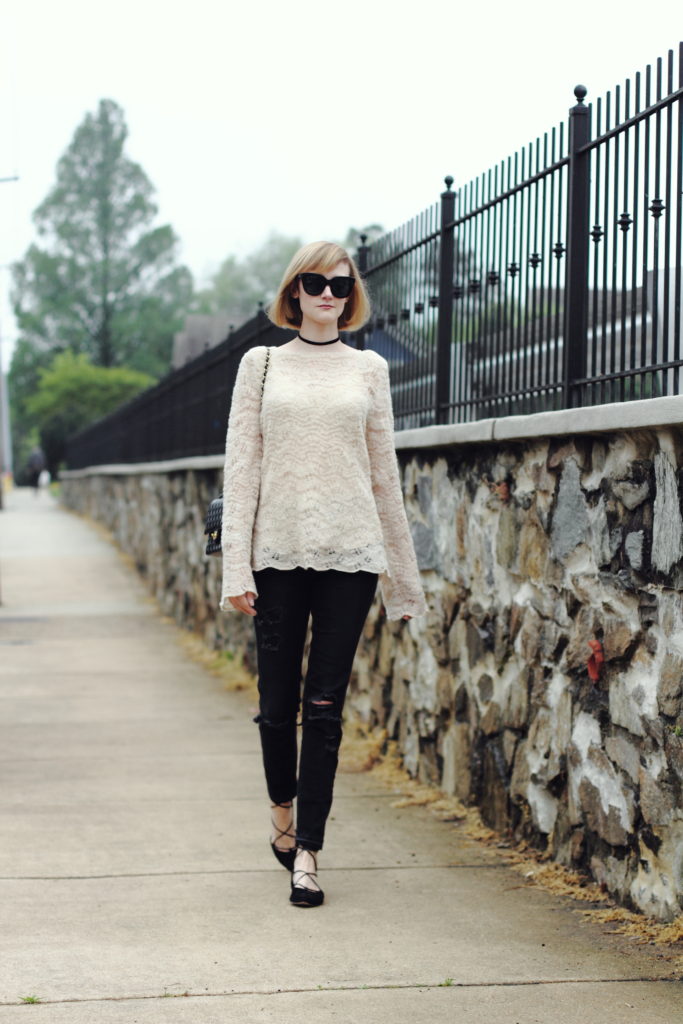 bell-sleeved sweater and distressed denim