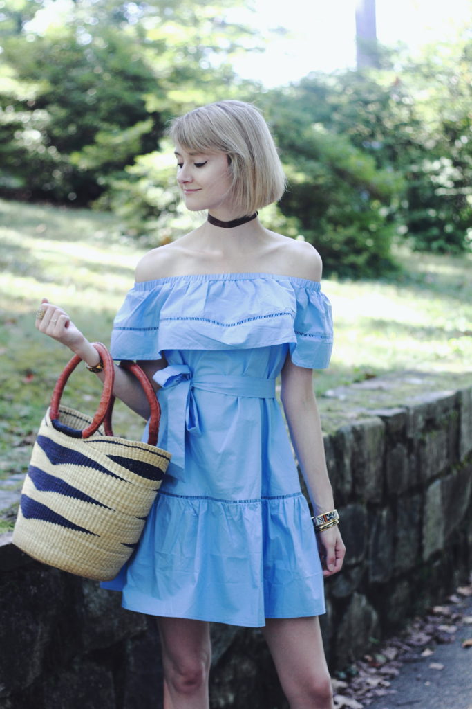 ruffled off-the-shoulder dress and straw bag