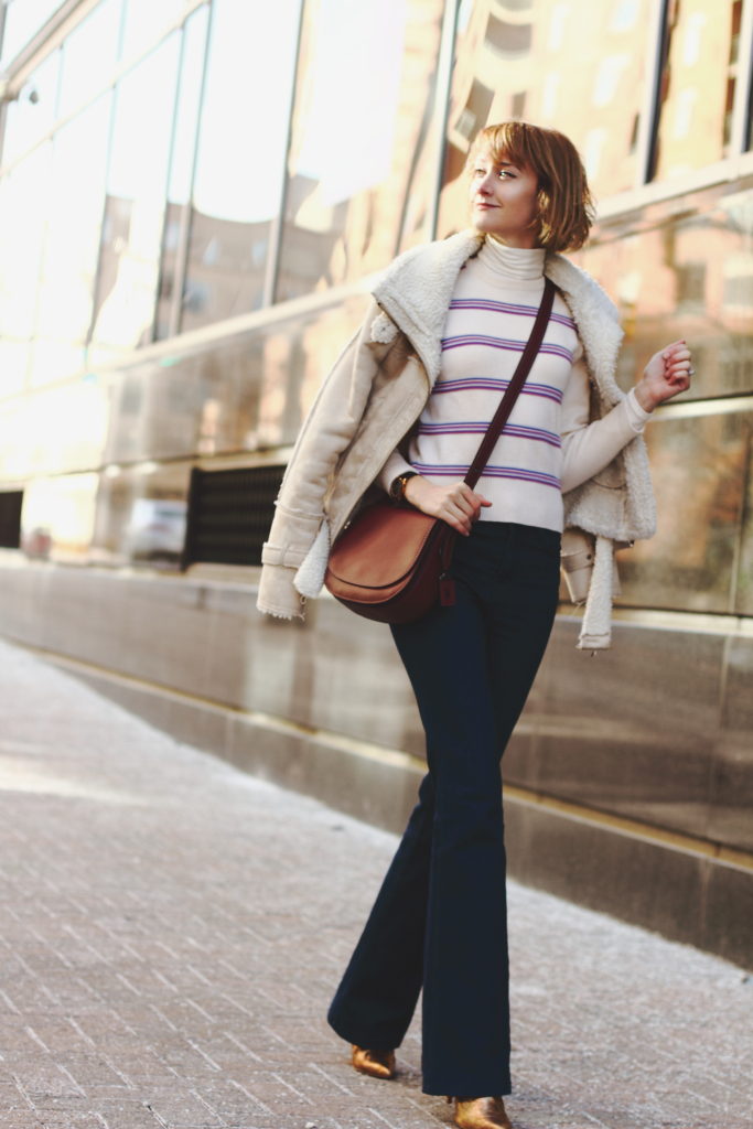 vintage ski sweater, flared jeans and Coach bag