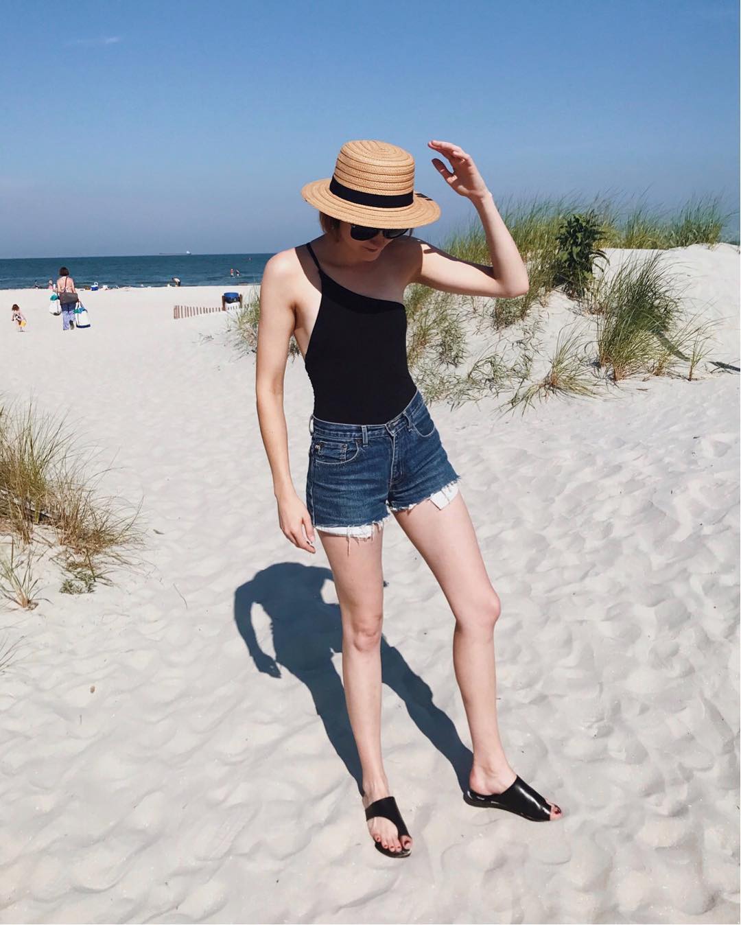 Alix one piece swimsuit, straw boater hat, and ATP Atelier sandals