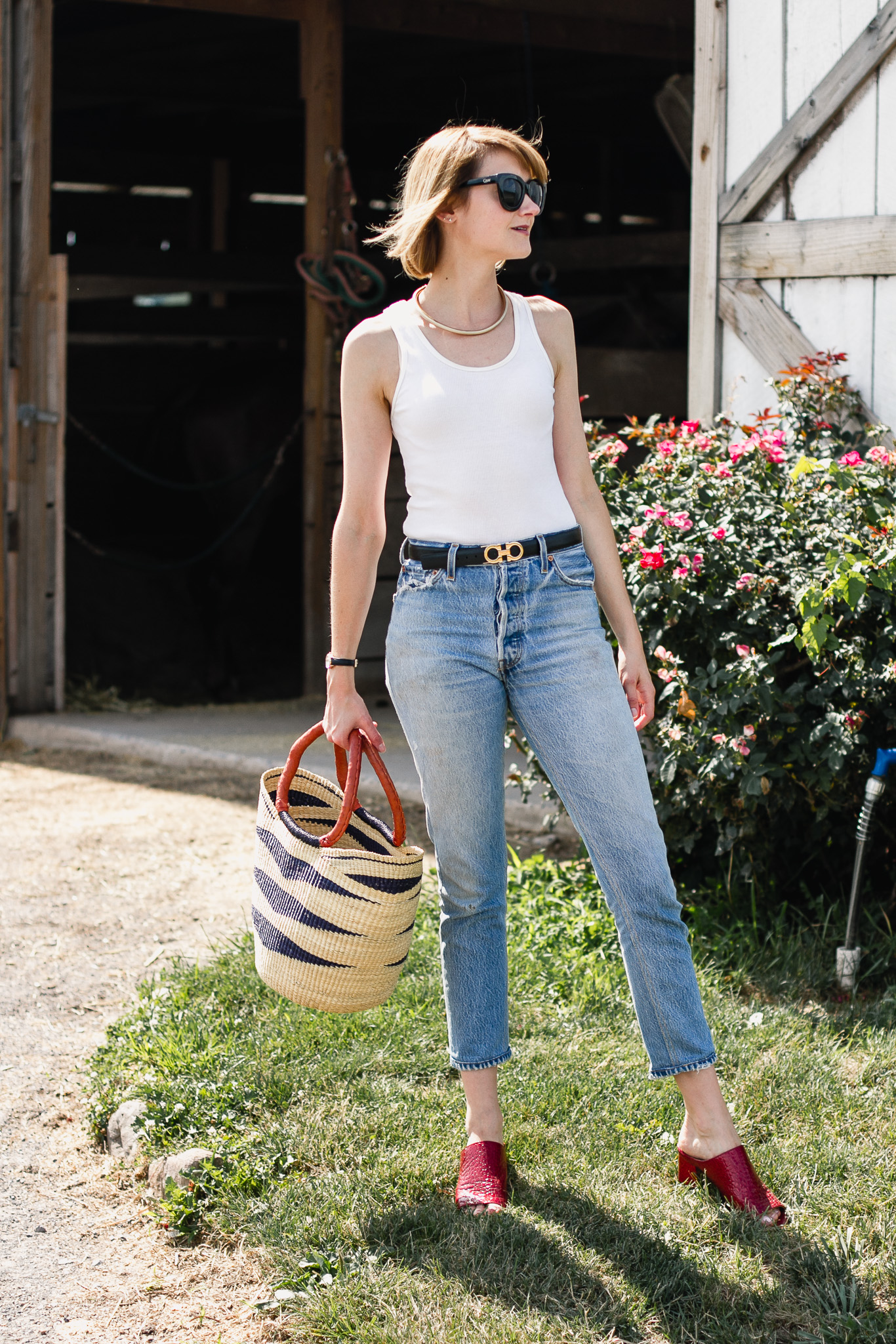 white tank top, Re/Done jeans and red mules