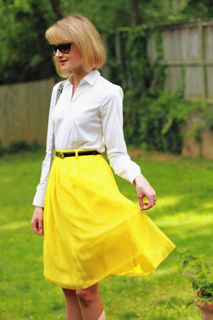 white button-down and yellow skirt