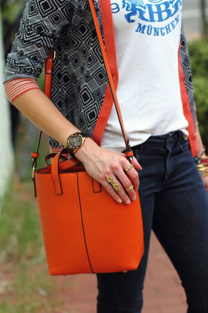 gold rings and orange tote