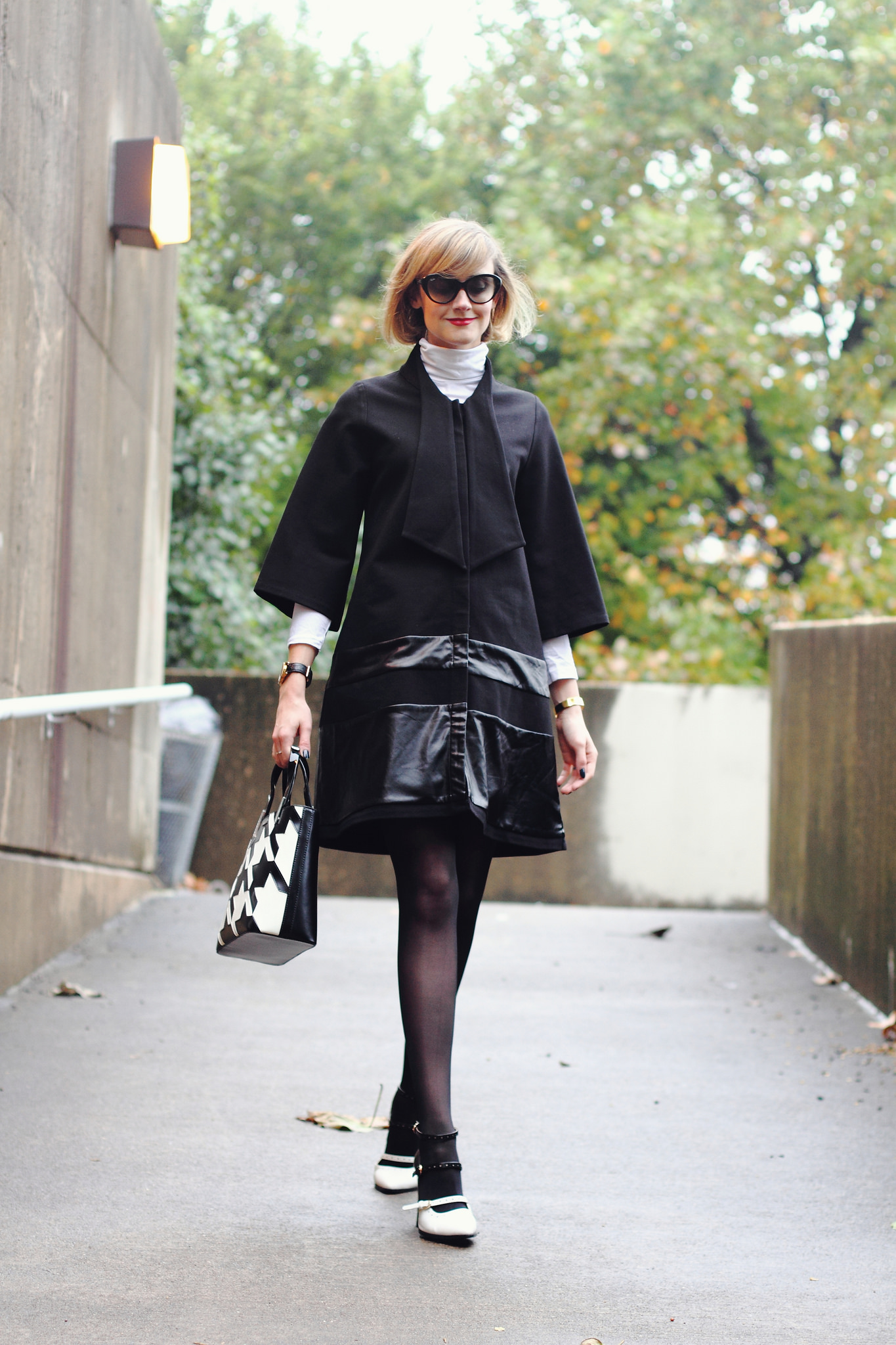 white turtleneck and black tie coat