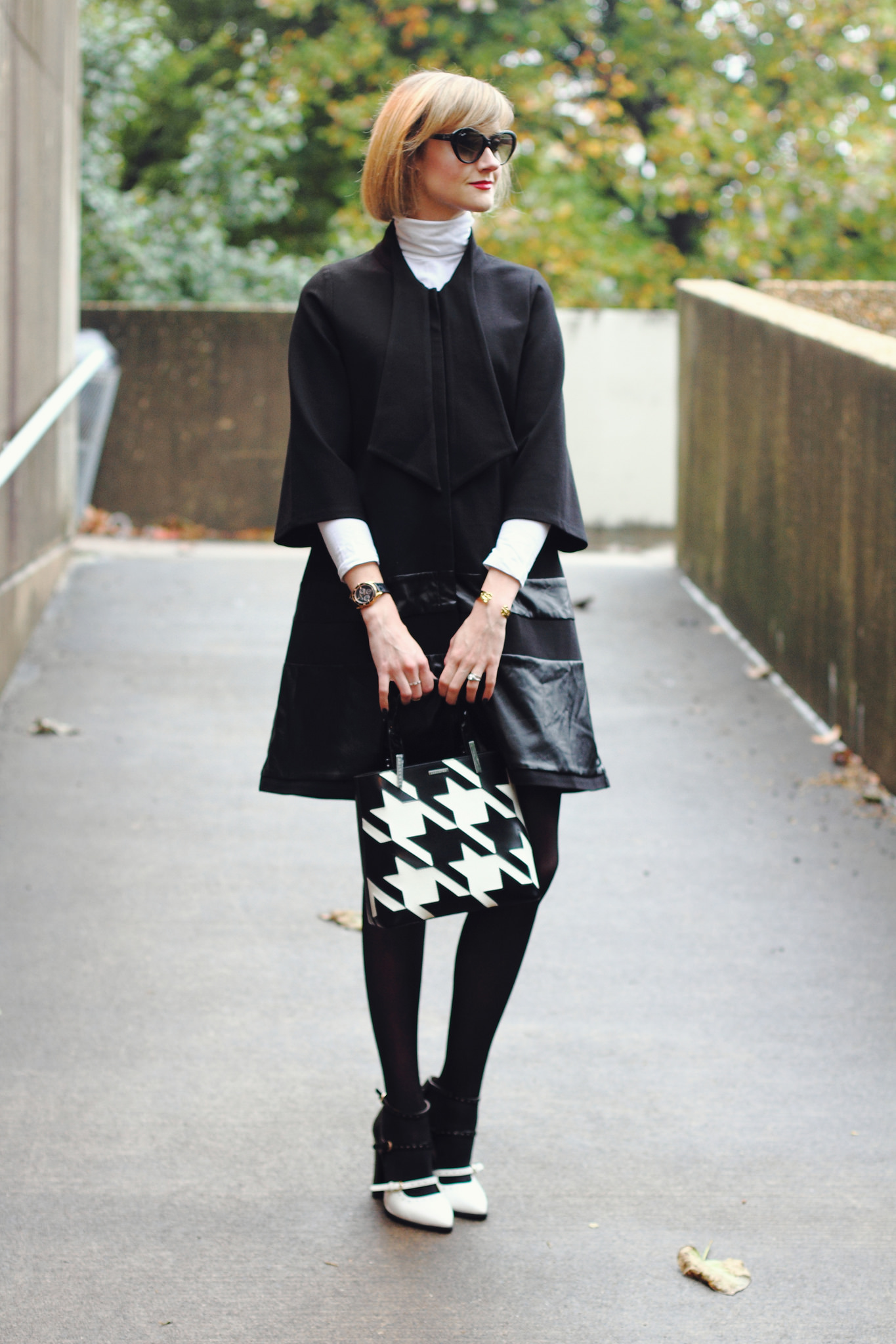 white turtleneck and black tie coat