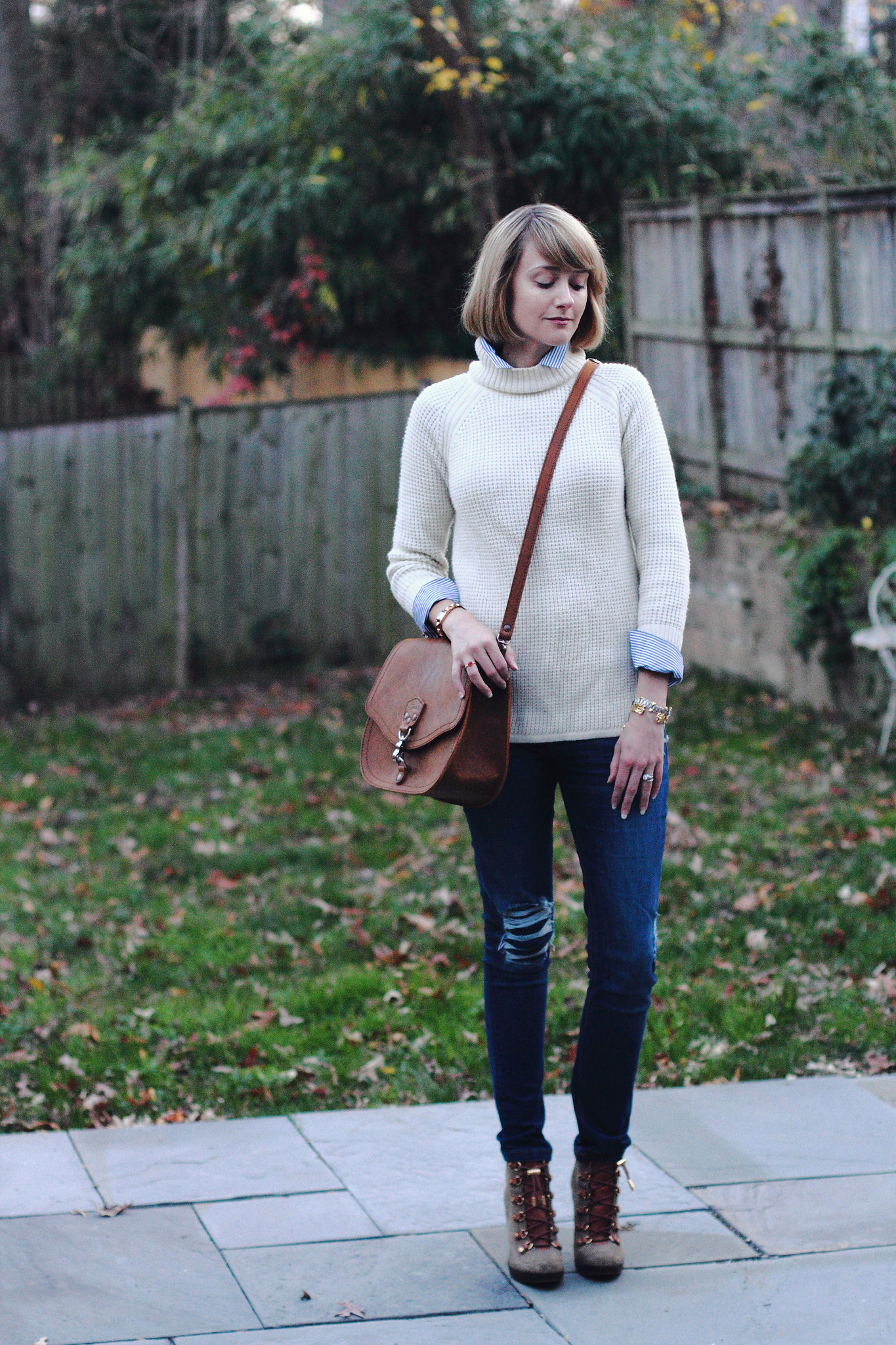 Banana Republic sweater and Saddleback Leather bag