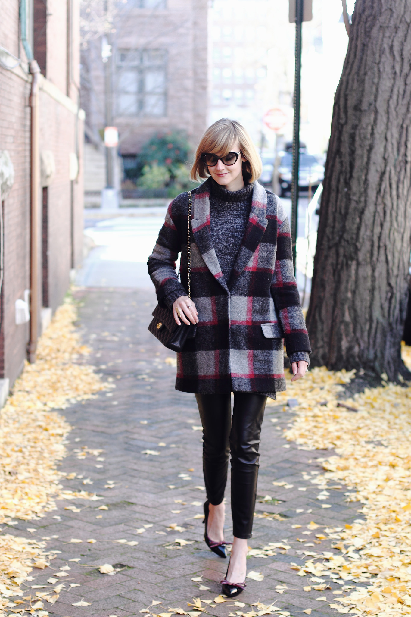 plaid coat and leather leggings