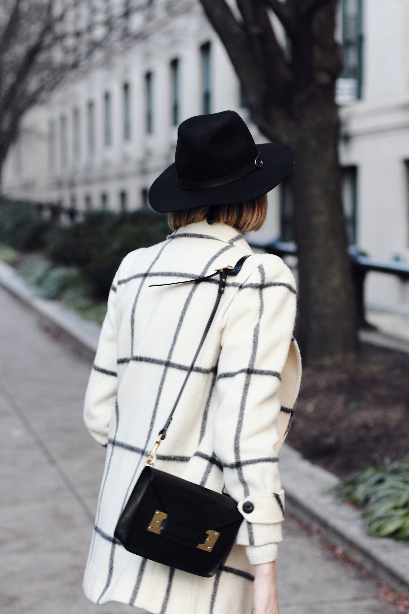 vintage check coat and black fedora