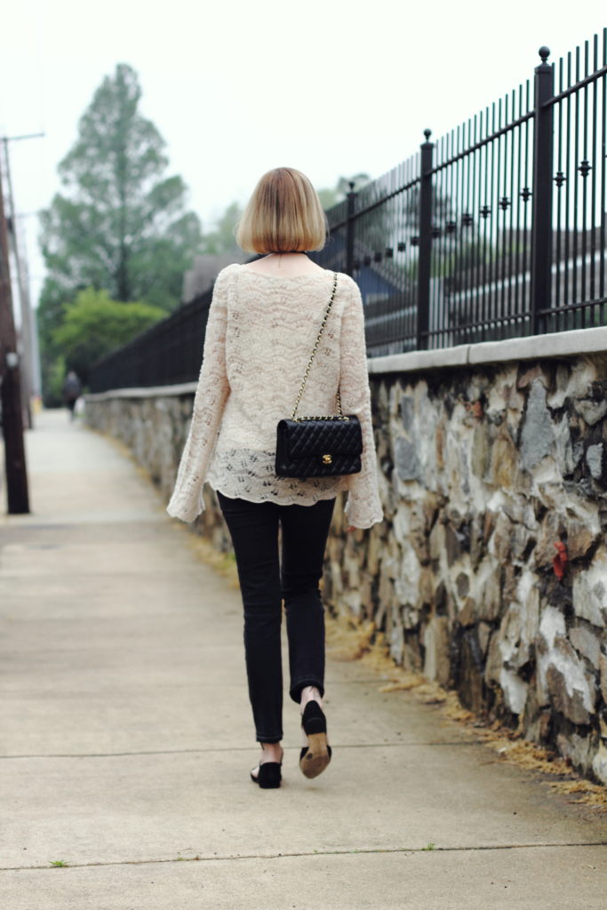 bell-sleeved sweater and distressed denim