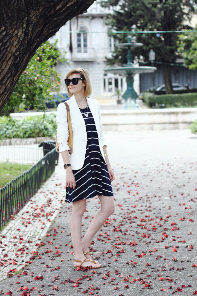 white blazer and striped navy dress