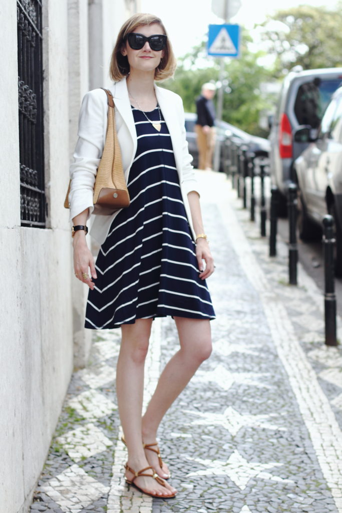 white blazer and navy striped dress