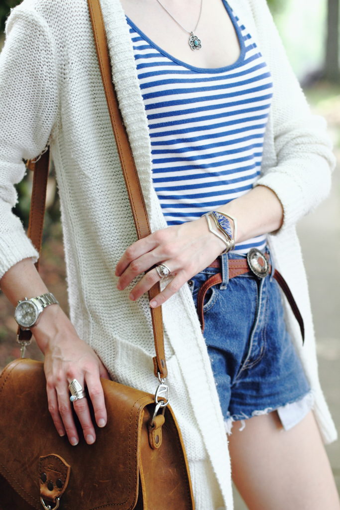 striped top, cut-offs, and silver jewelry