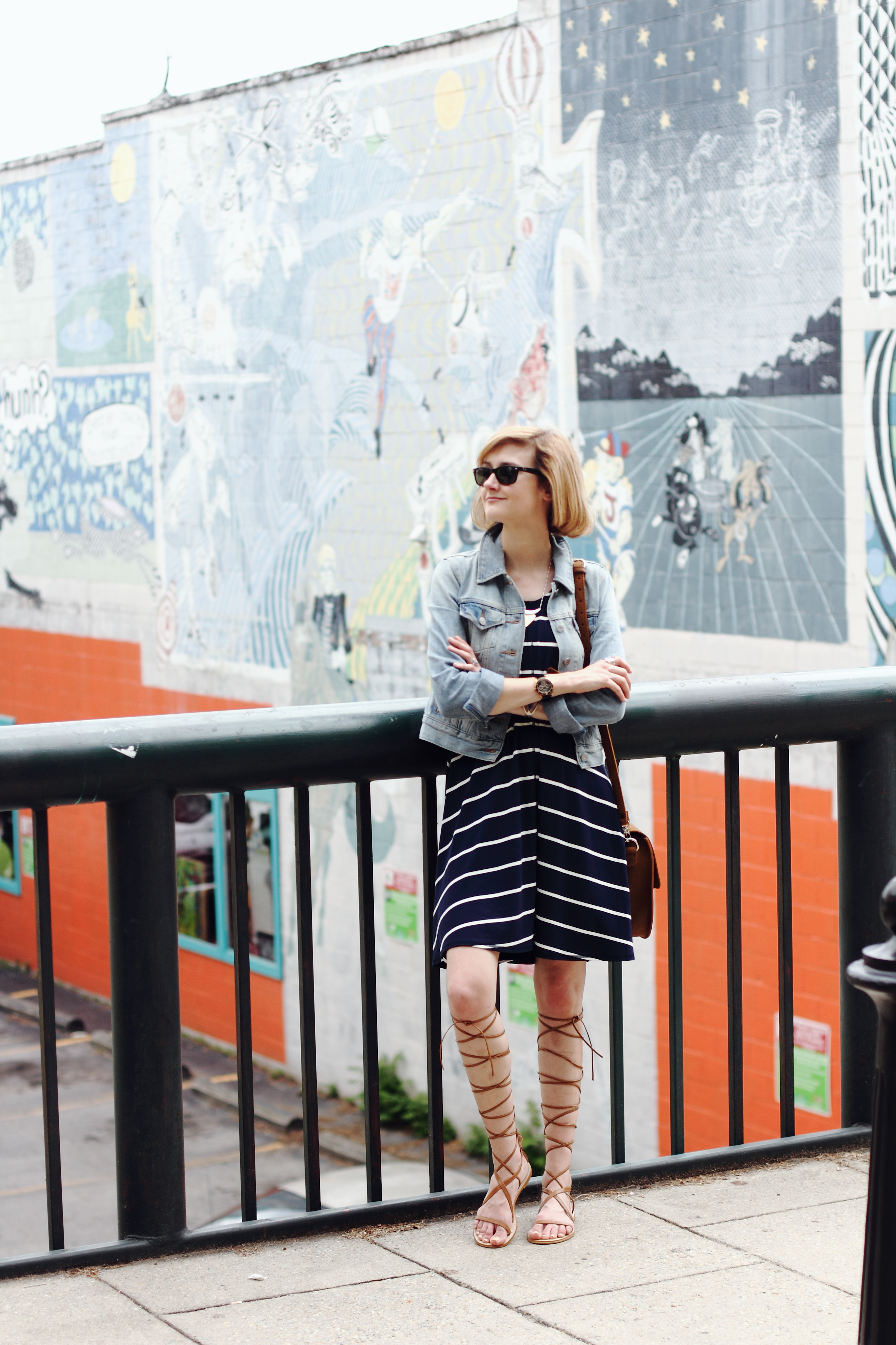 striped dress, denim jacket, and gladiator sandals