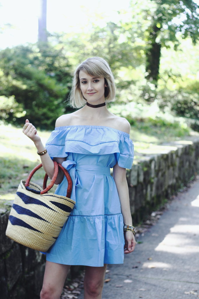 ruffled off-the-shoulder dress and straw bag