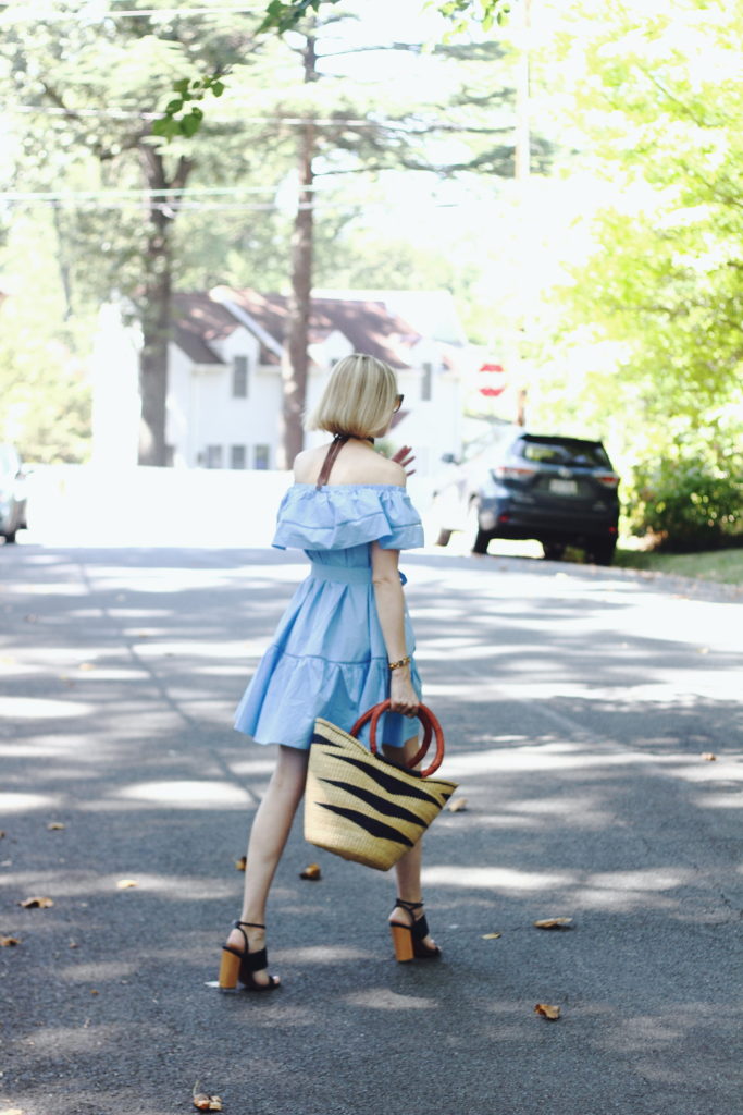 off-the-shoulder dress and straw bag