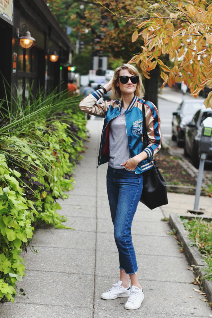 satin bomber, cropped jeans, and Stan Smiths