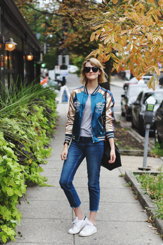 satin bomber, cropped jeans, and Stan Smiths