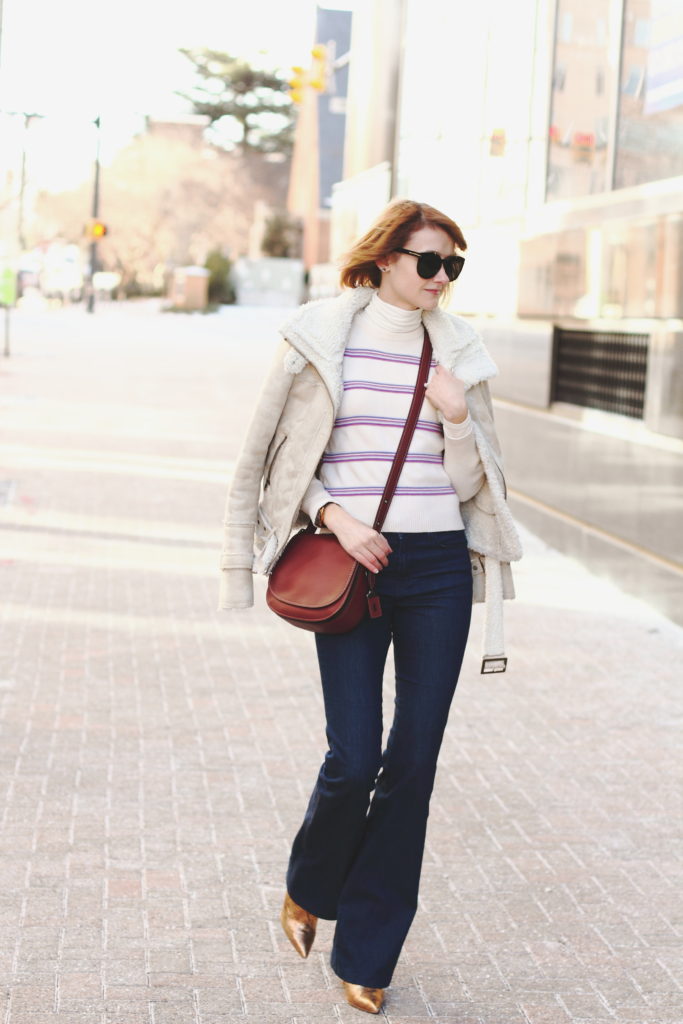 vintage ski sweater, flared jeans and Coach bag