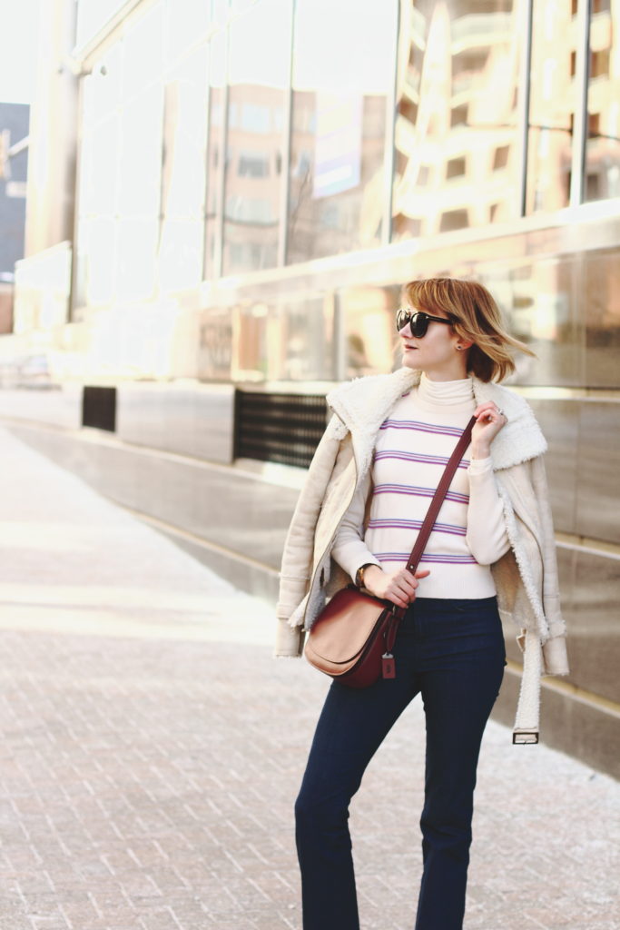 vintage ski sweater, shearling jacket, and Coach bag