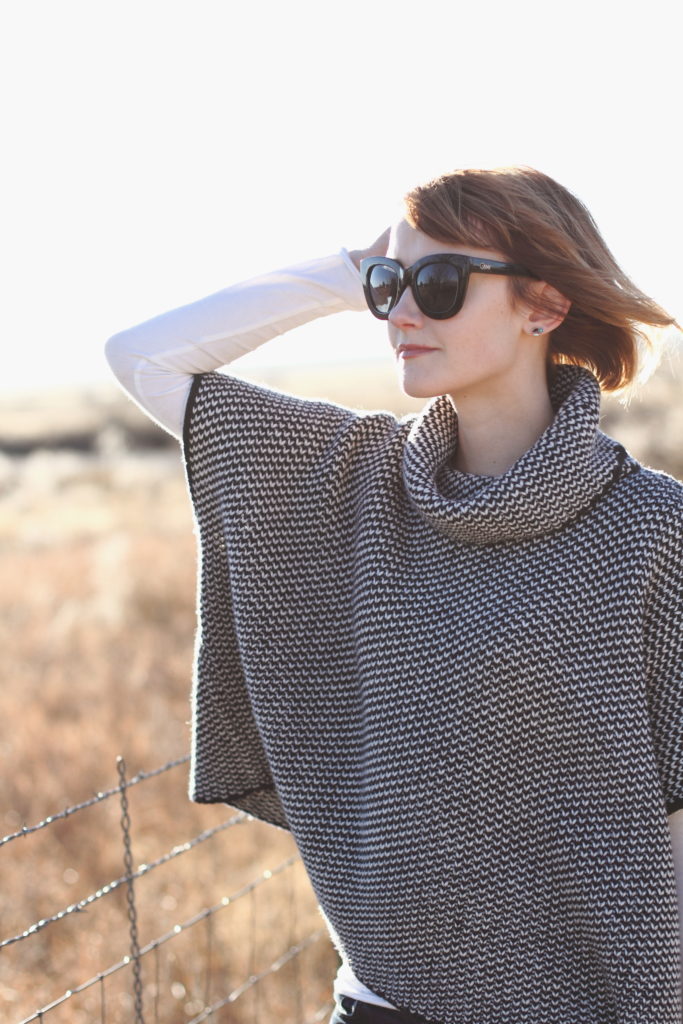 Woolovers poncho and Quay sunglasses