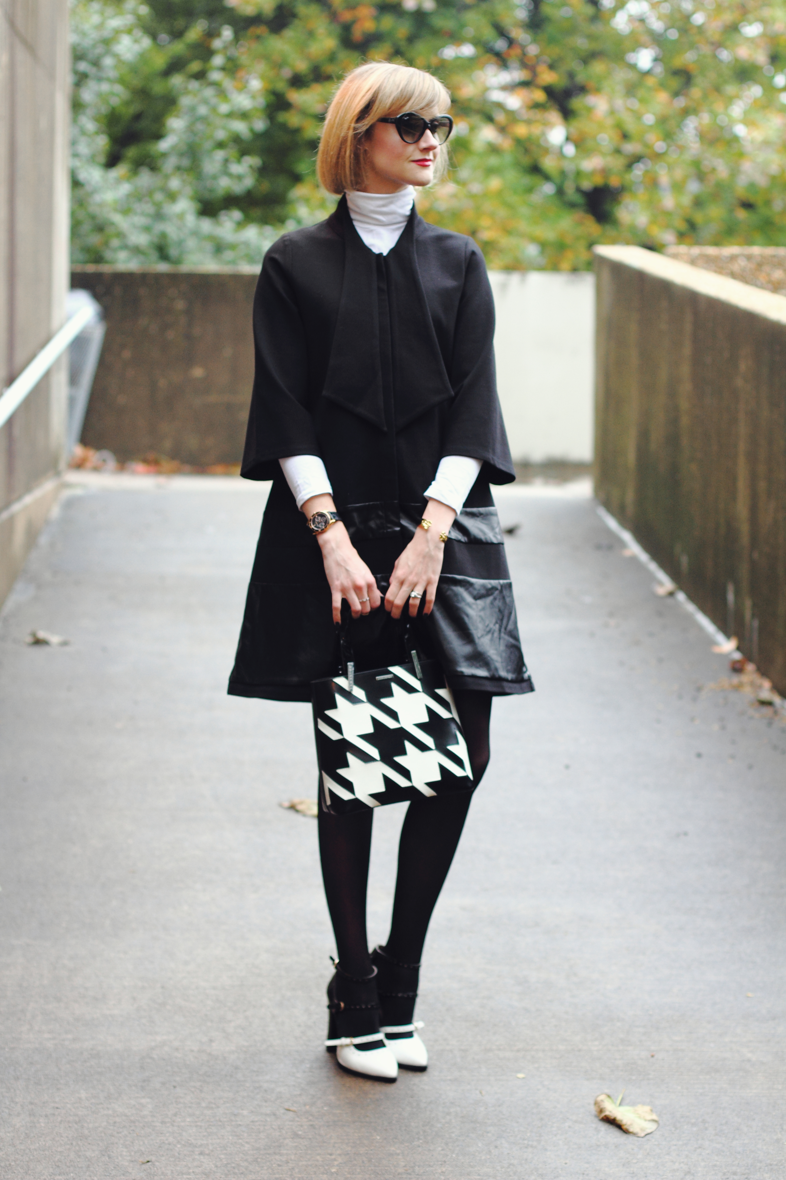 flared coat and white turtleneck