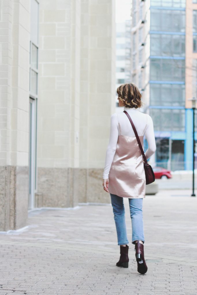 turtleneck, layering slip dress, and Coach bag