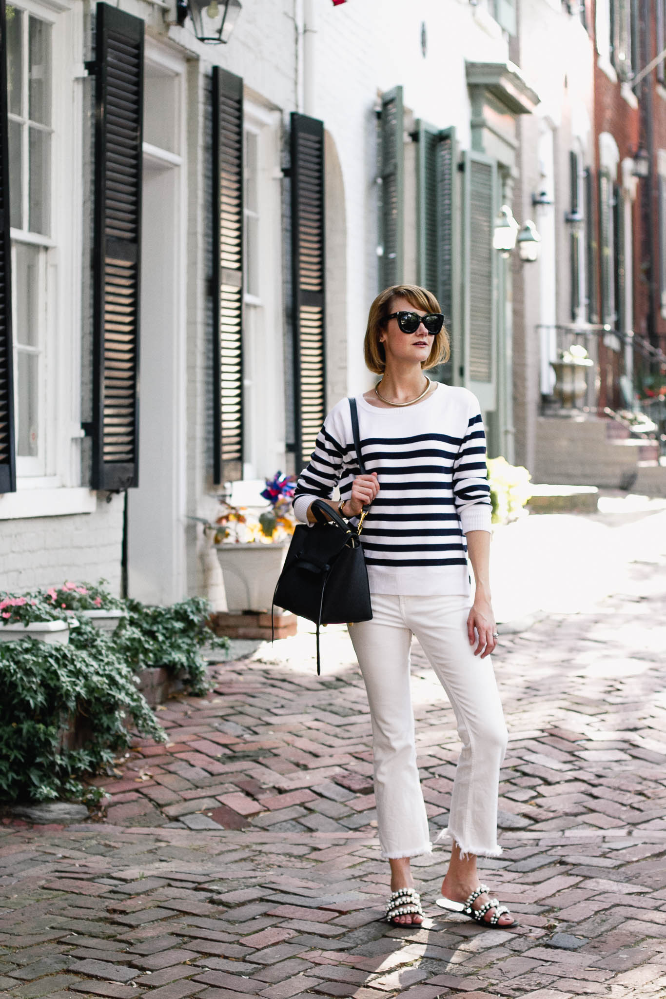striped sweater, white denim, and pearl slides