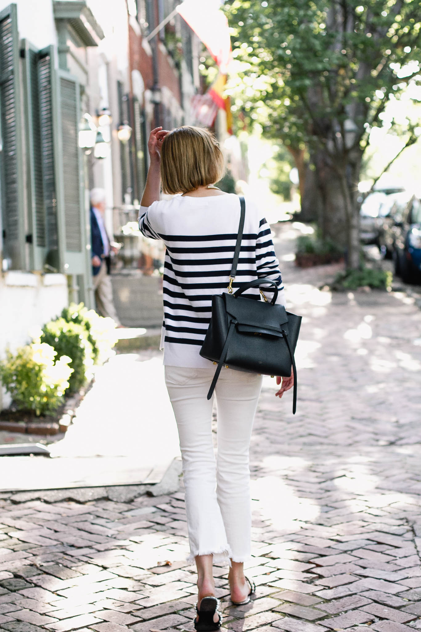 striped sweater, white denim, and pearl slides