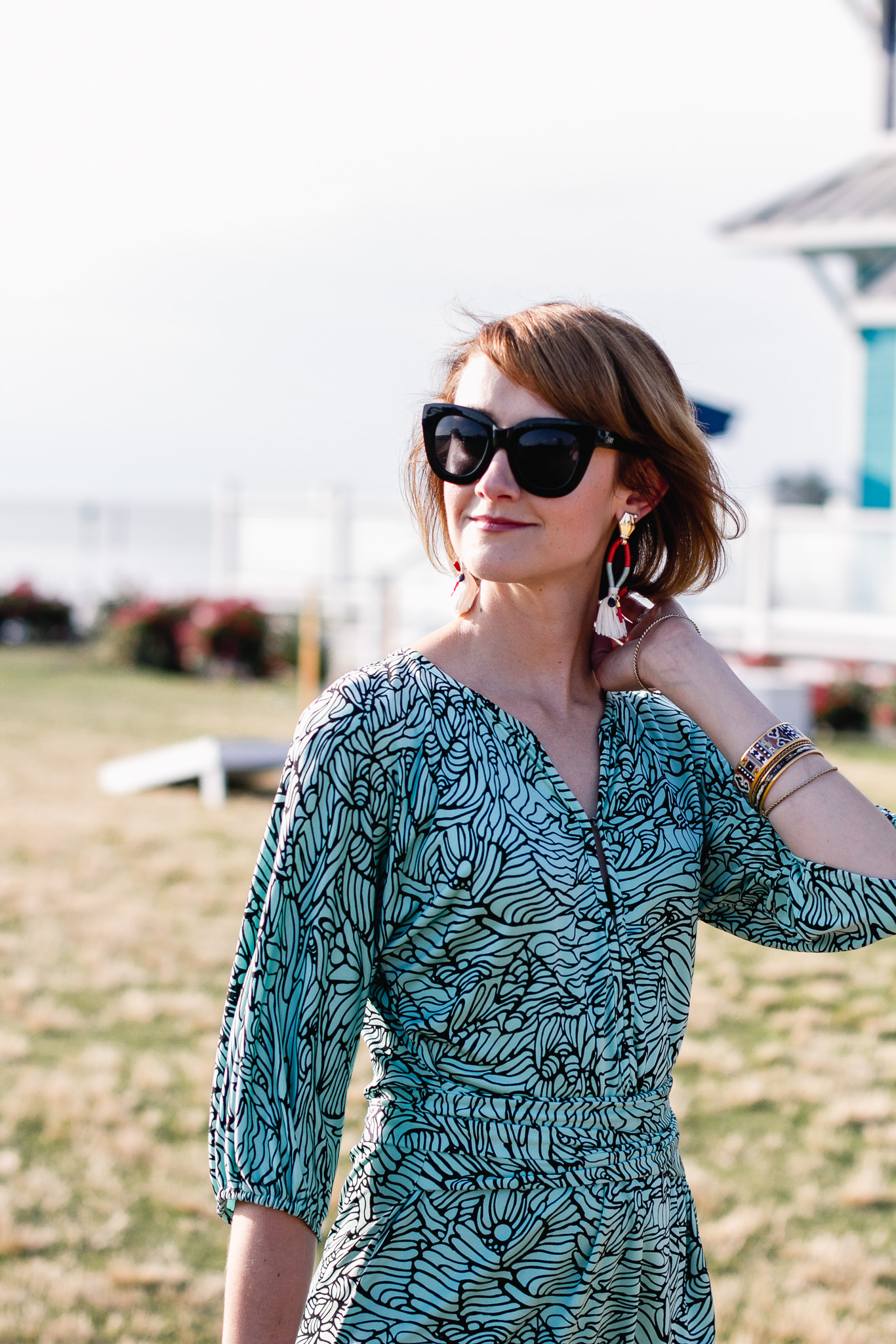 Quay sunglasses and Mara Hoffman mini dress