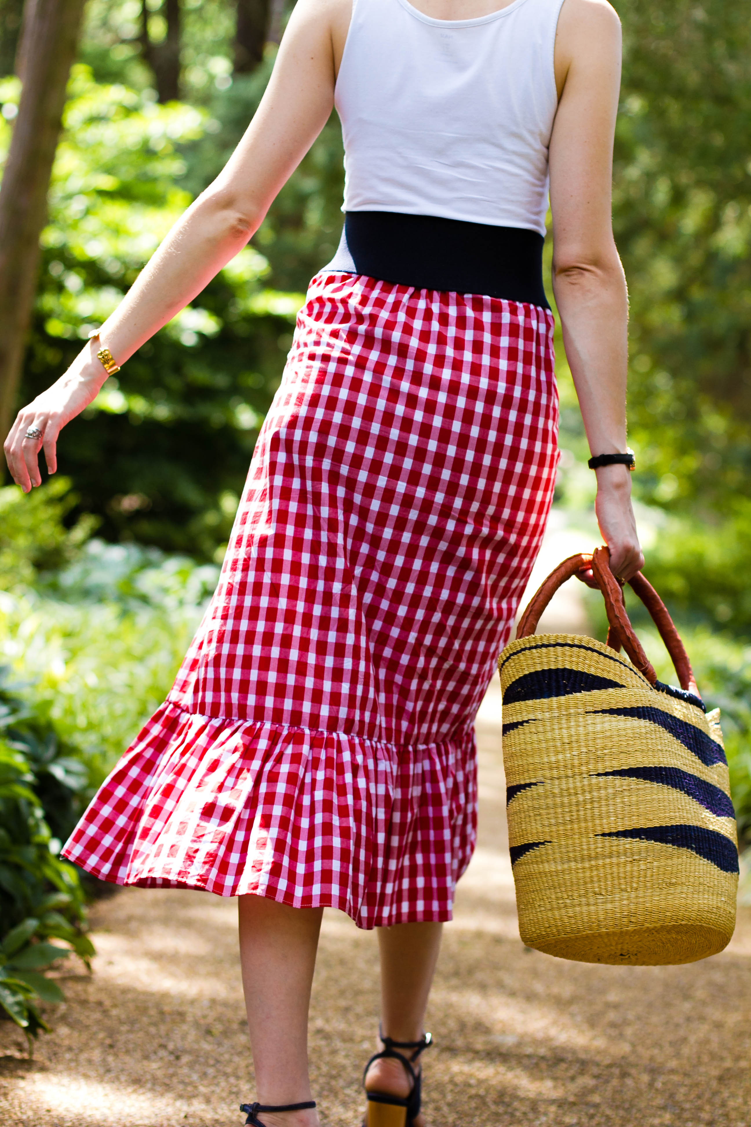 Zara gingham skirt, straw bag, and Cluse watch