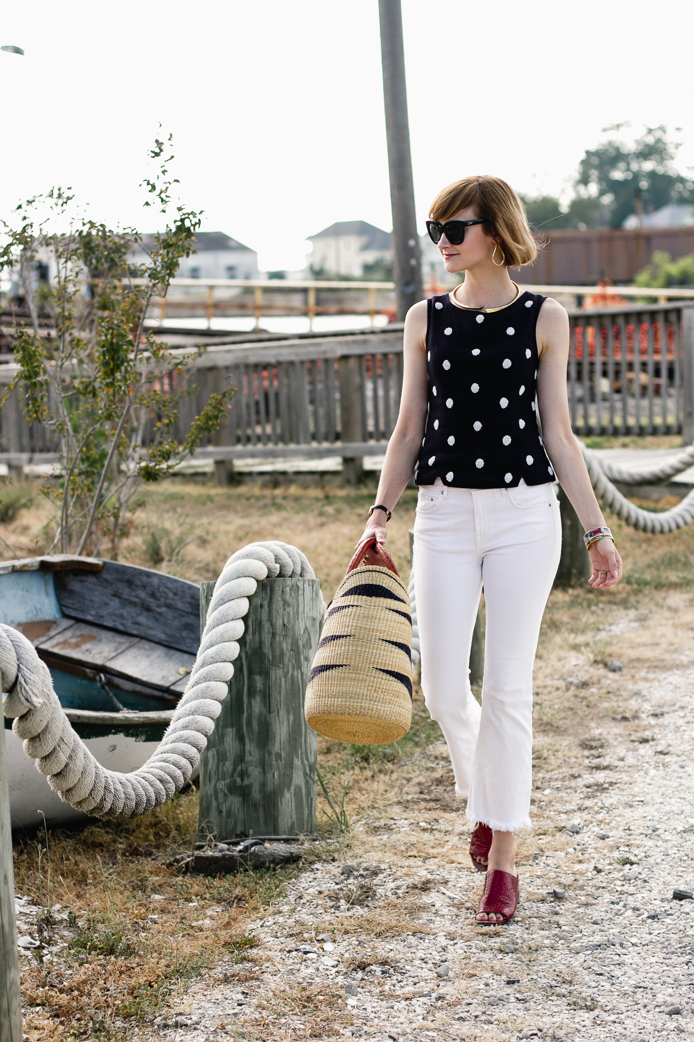 polka dot top, white denim, and red mules