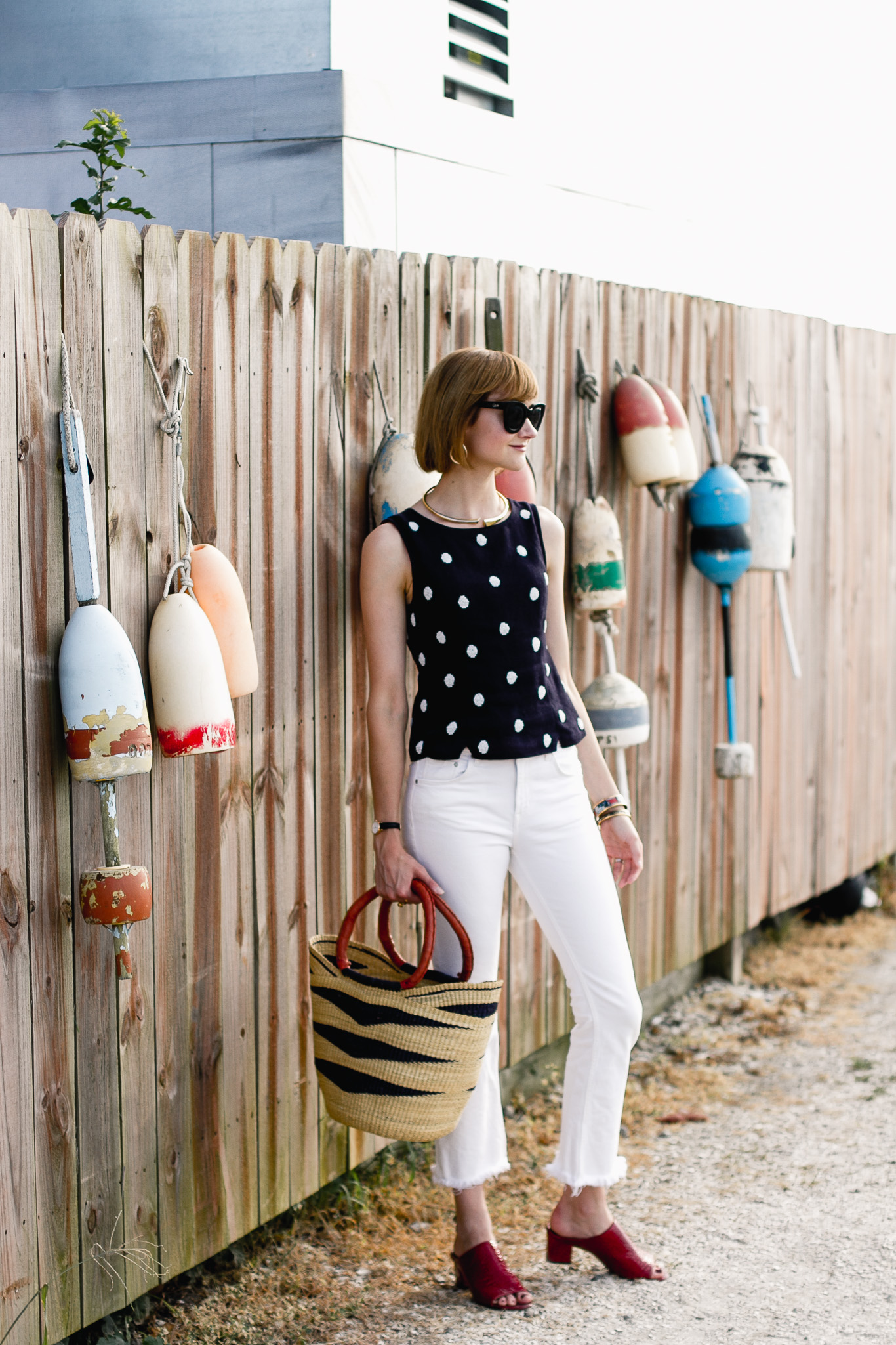 polka dot top, white denim, and red mules