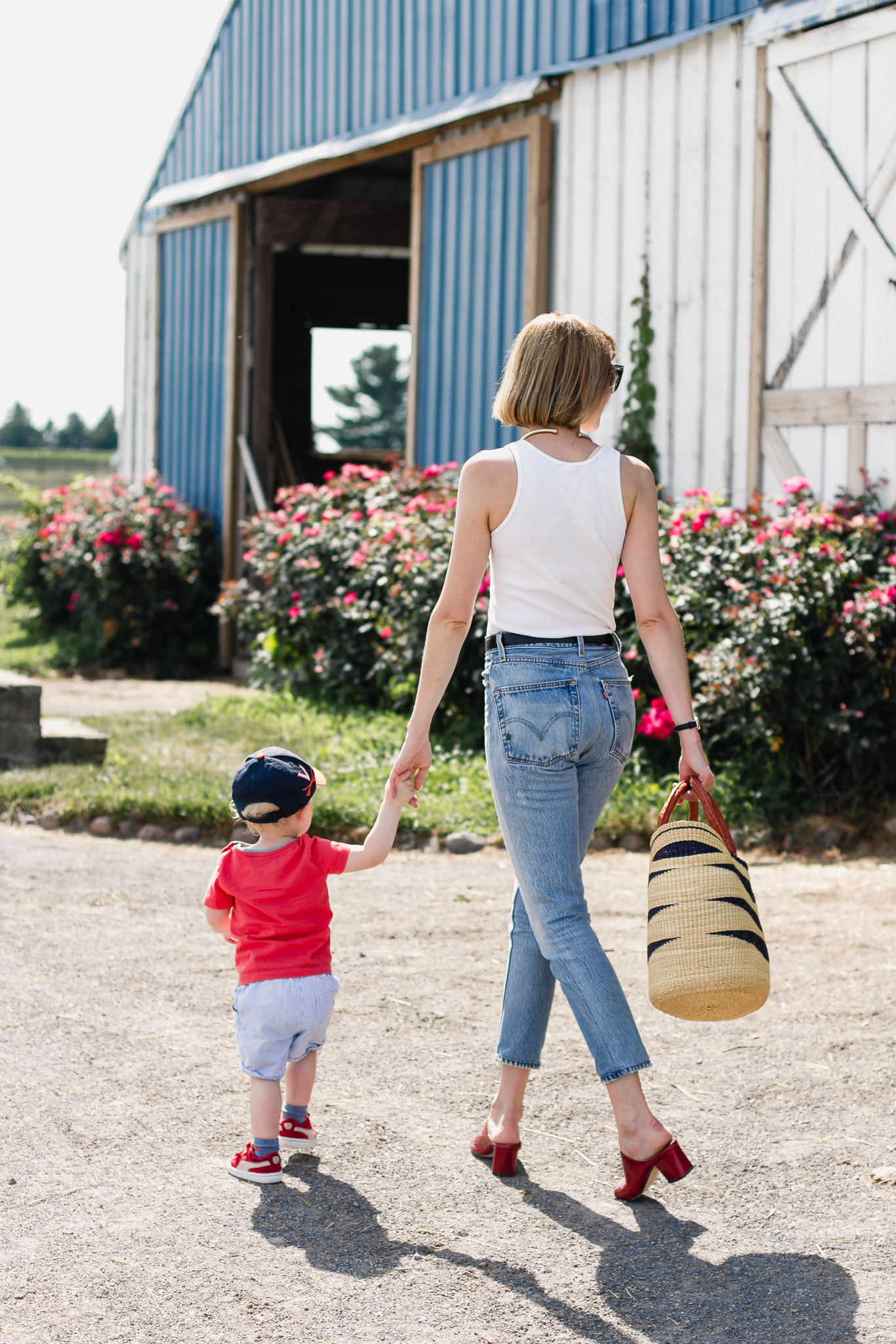 white tank top, Re/Done jeans and red mules