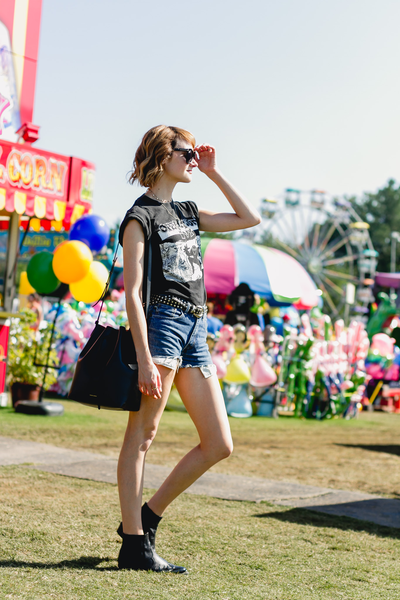 Op Ivy t-shirt, denim shorts, and Topshop western boots