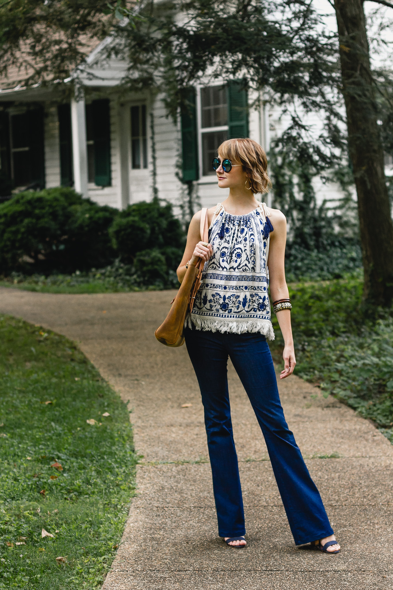 Mango top, J brand flare jeans, and Saddleback Leather bag