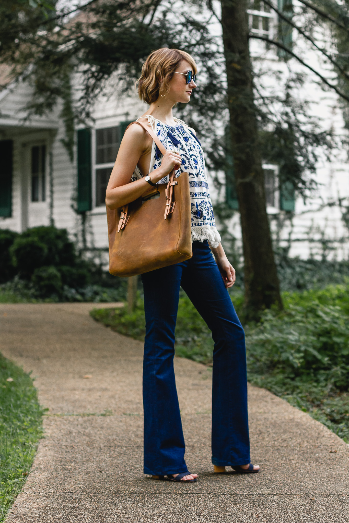 Mango top, J brand flare jeans, and Saddleback Leather bag