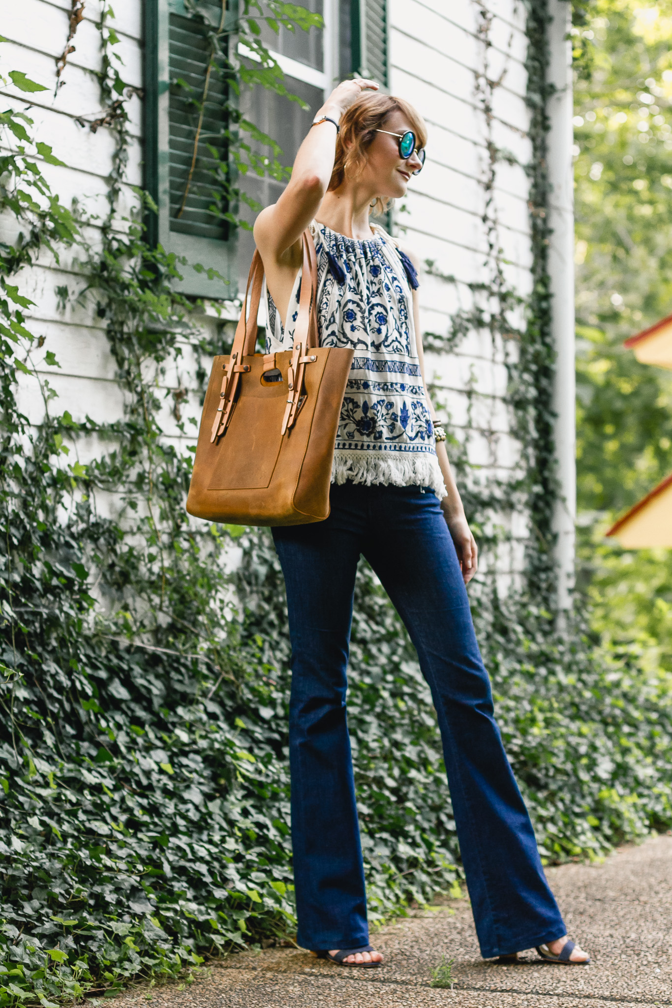 Mango top, J brand flare jeans, and Saddleback Leather bag