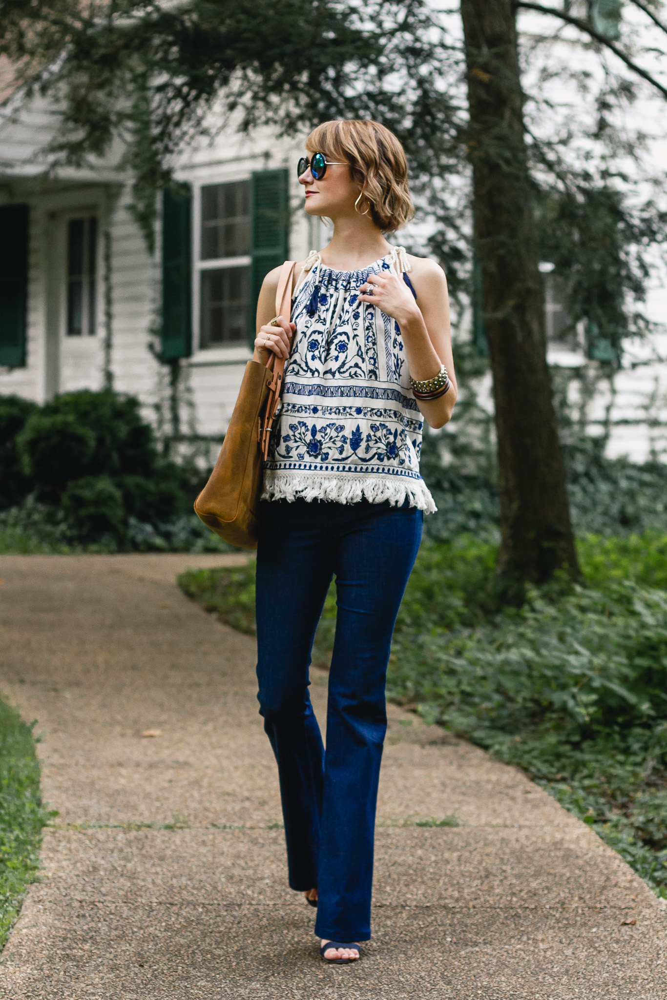 Mango top, J brand flare jeans, and Saddleback Leather bag