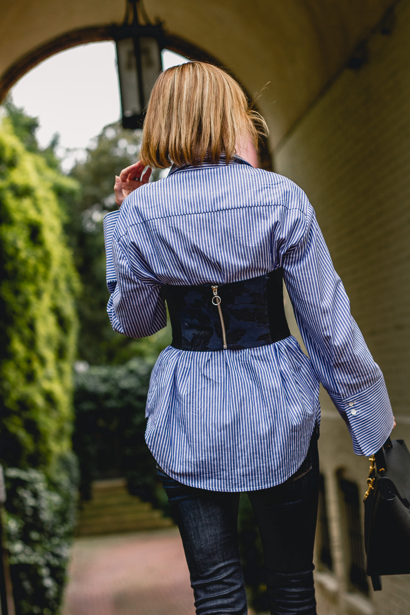 Mango bustier layered over pinstriped shirt