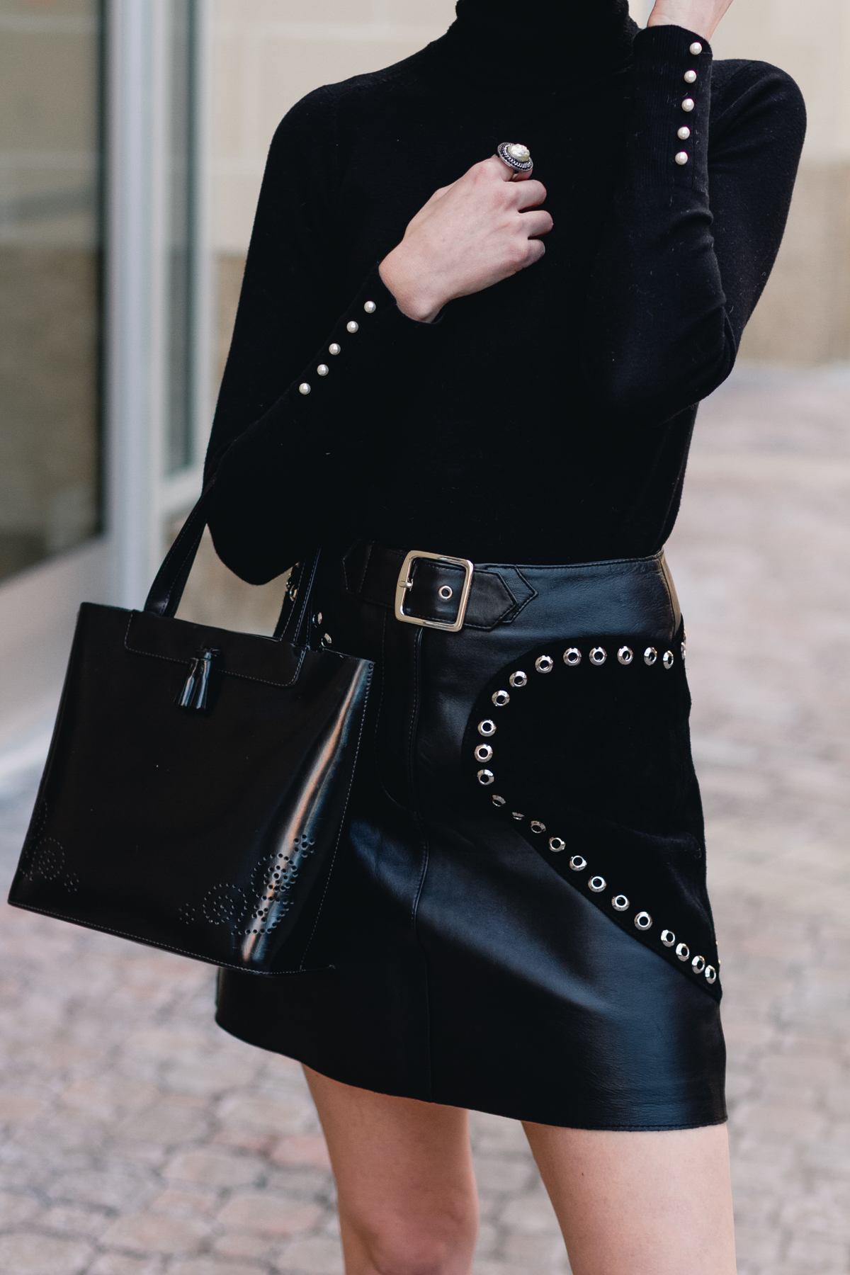 black turtleneck and Maje leather skirt