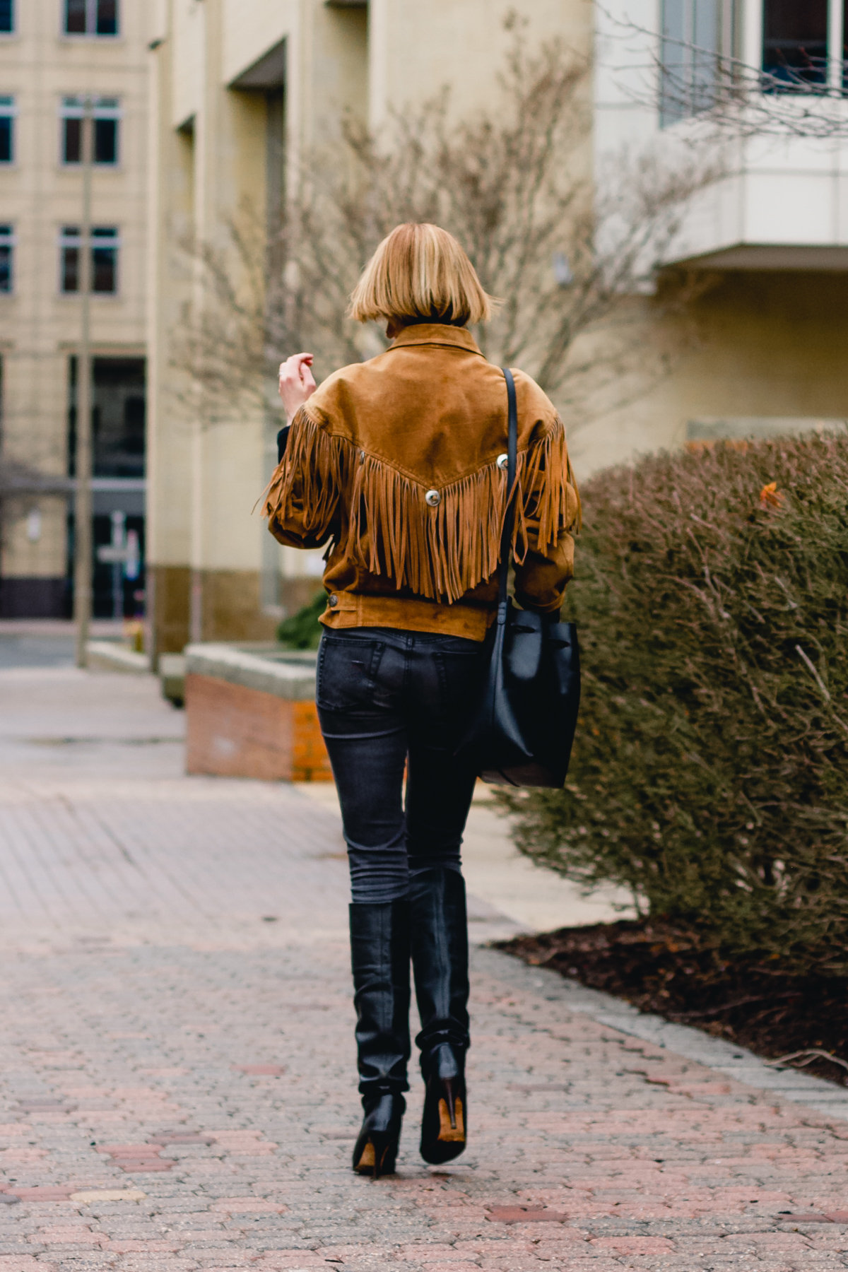 fringe leather jacket and slouchy boots