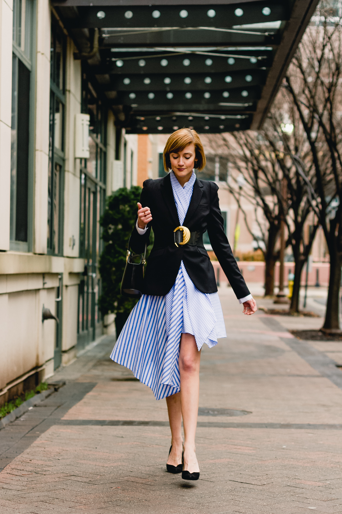 belted blazer and striped asymmetrical dress