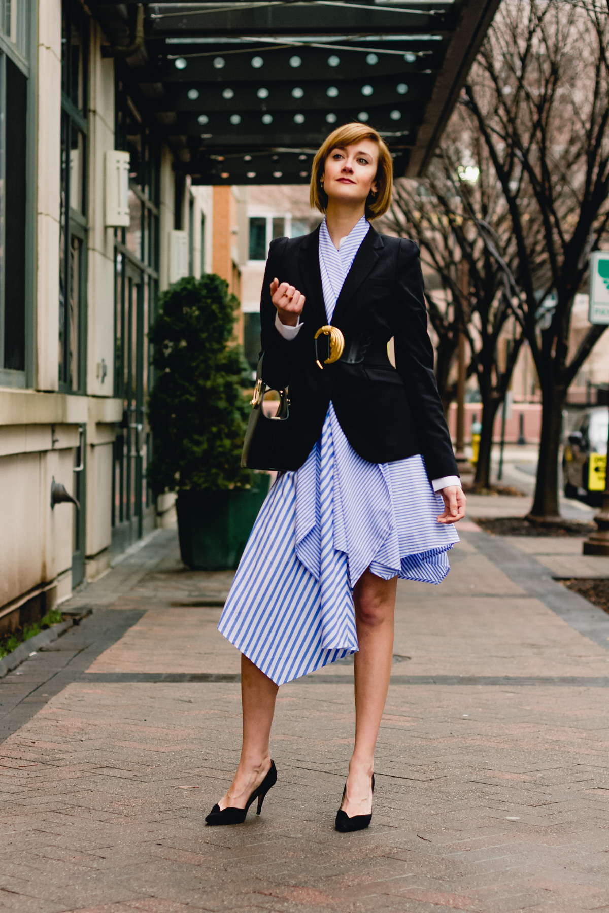 belted blazer and striped asymmetrical dress