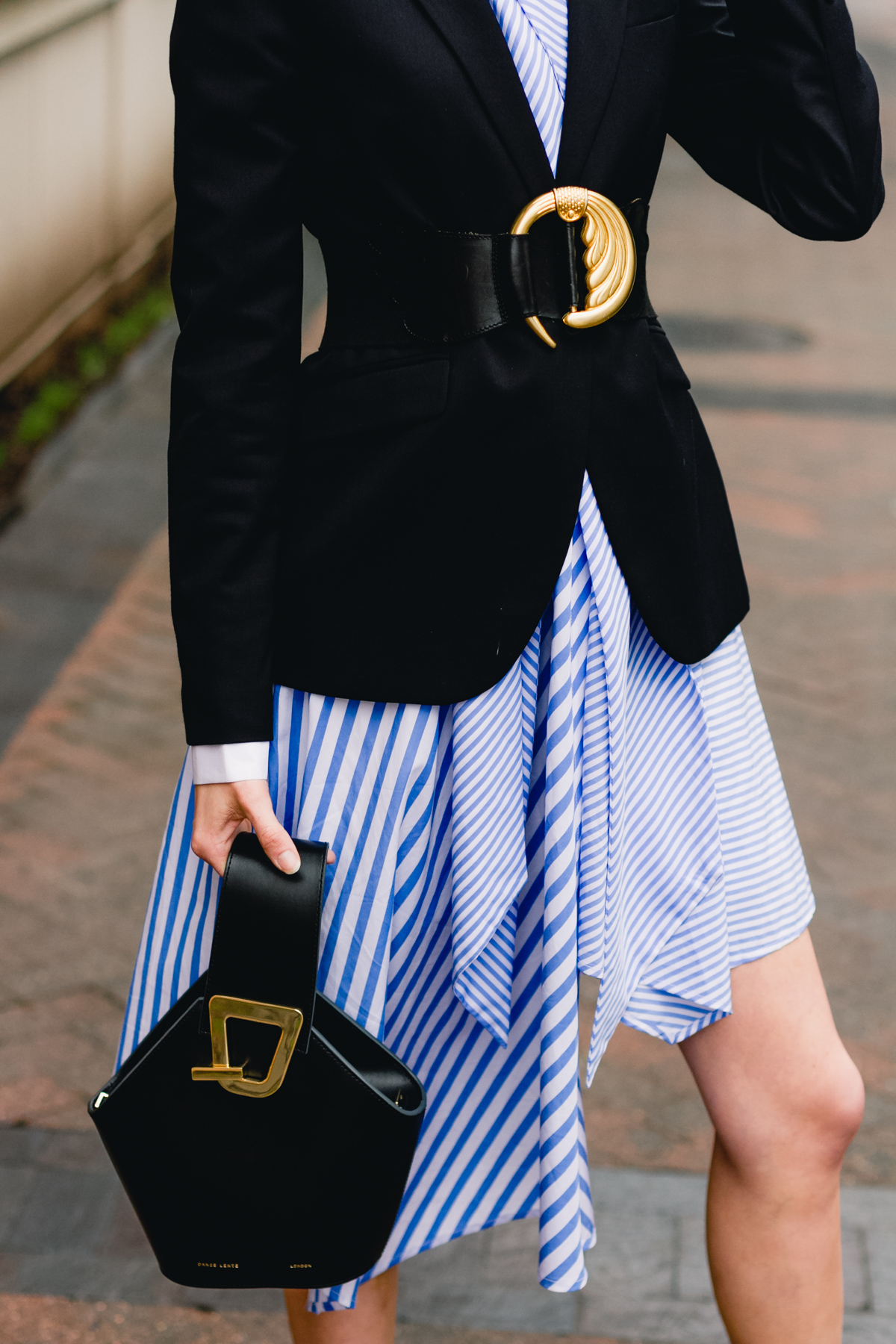 belted blazer and striped asymmetrical dress