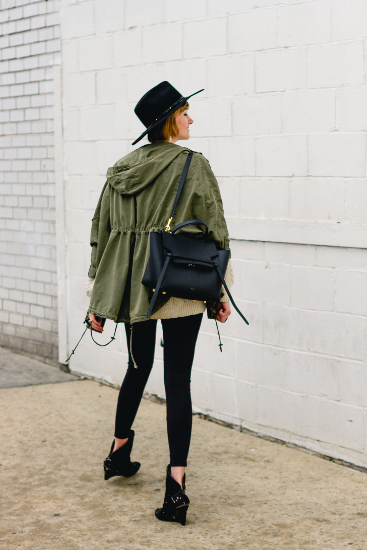 layered anorak, fisherman's knit, and suede leggings