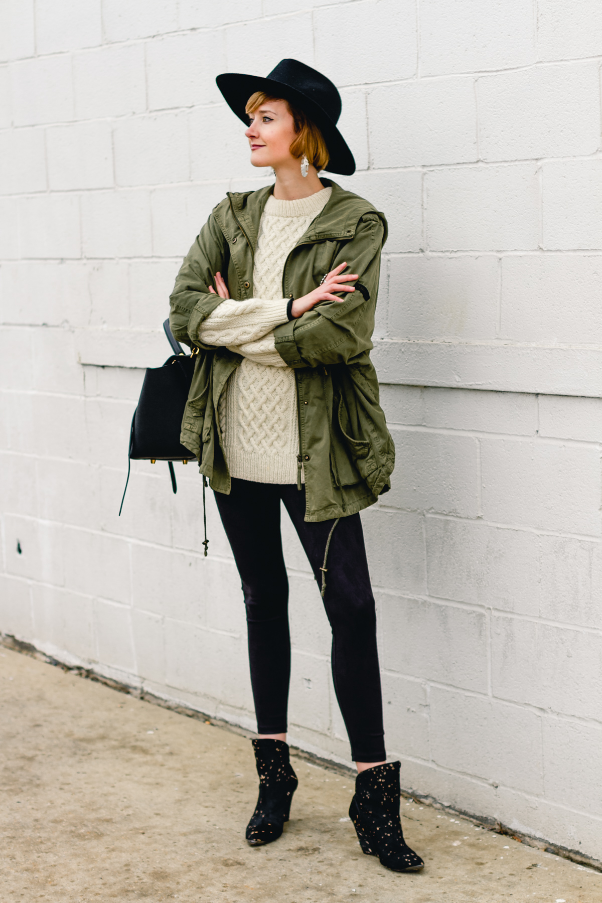 layered anorak, fisherman's knit, and suede leggings