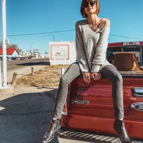 J. Crew sweater and western ankle boots