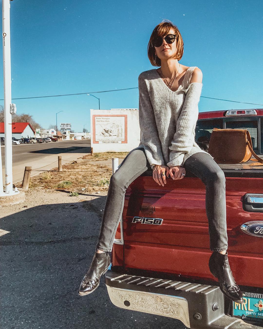 J. Crew sweater and western ankle boots