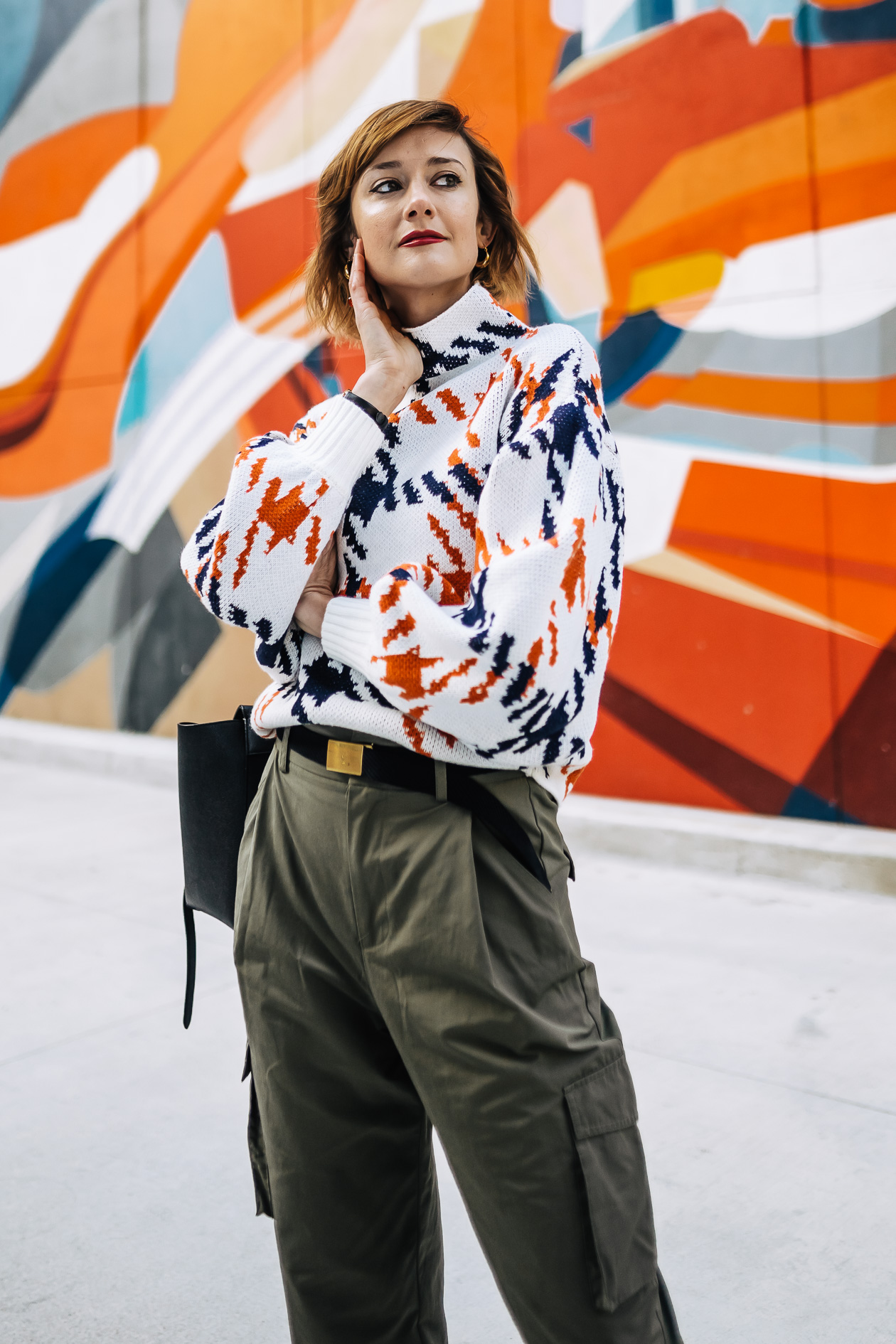 bright print sweater with cargo pants